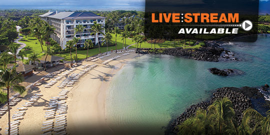 Aerial view of Fairmont Orchid Hawaii with a pool, lounge chairs, palm trees, and ocean in the background. Luxury resort location for accredited CME conferences on the Big Island of Hawaii.