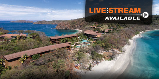 Aerial view of the Four Seasons Resort Costa Rica at Peninsula Papagayo, a luxury resort with cascading pools, lush vegetation, and beach access on the coast of Costa Rica.