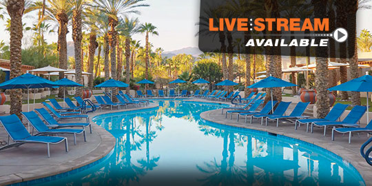 Inviting resort pool with palm trees and lounge chairs under a clear blue sky, showcasing the luxurious amenities of Palm Springs and Indian Wells CME/CE conferences.