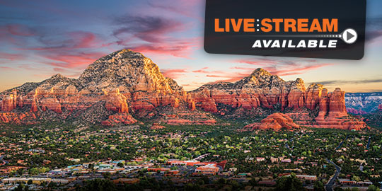 Majestic red rock formations rise above the lush greenery of Sedona, Arizona, a stunning backdrop for CME/CE conferences with live stream options.