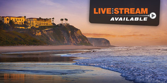 Sunset view from the beach in Laguna Beach, California, with the Ritz-Carlton, Laguna Niguel, perched on a hill overlooking the Pacific Ocean.