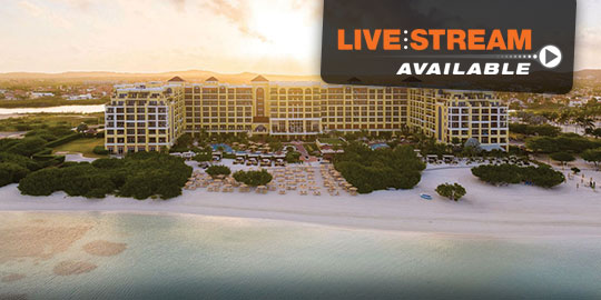 Sunset aerial view of Aruba Ritz-Carlton Beach Resort, perfect for CME conferences with luxury and tropical landscapes.
